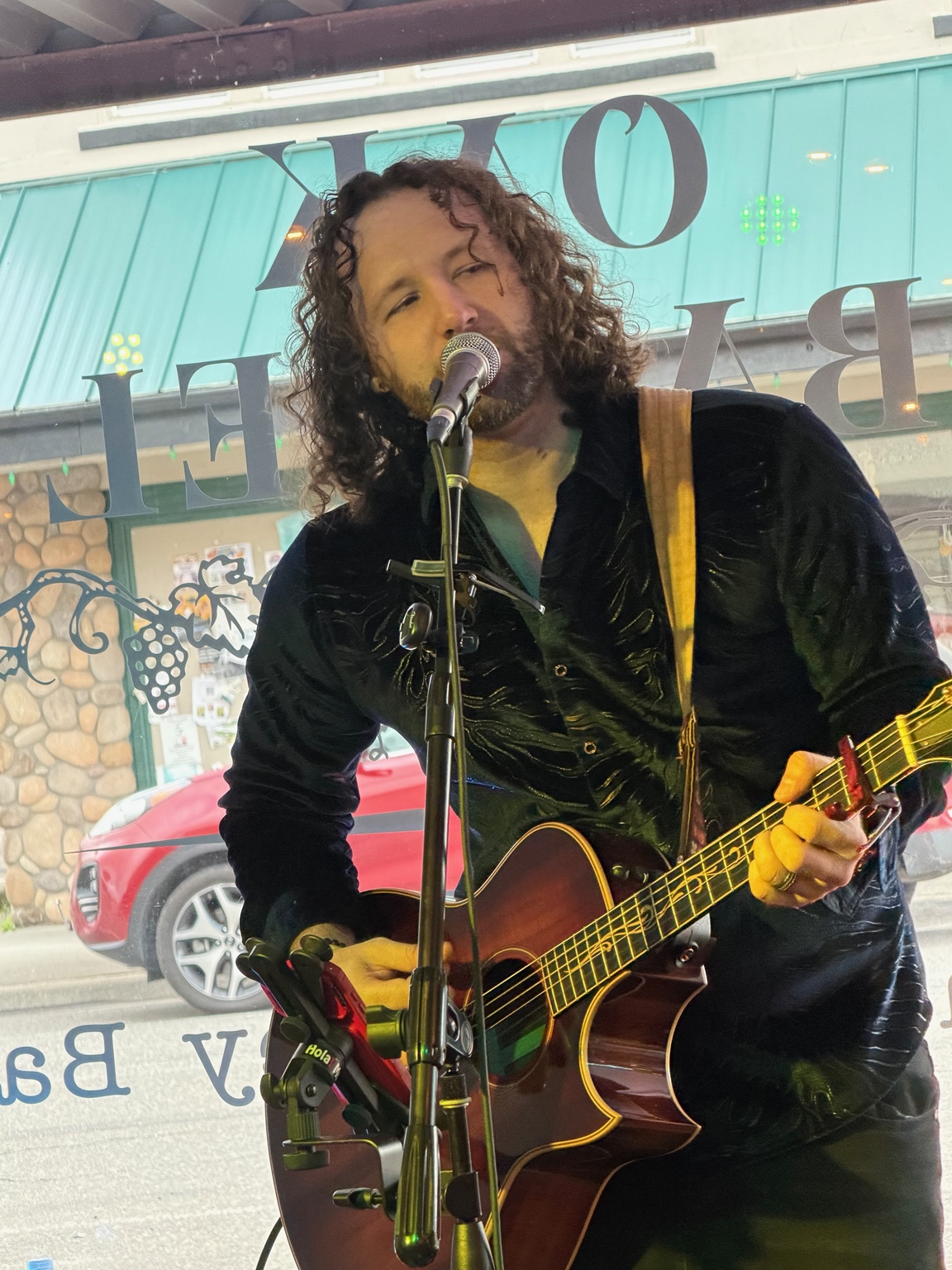 Patrick Leaver performing live with guitar